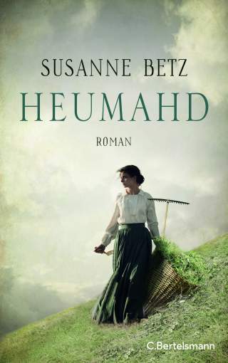 Buchcover zeigt eine Frau in historischer Kleidung, die mit einer Heugabel und einem großen Korb auf einer Wiese steht, vor einem bewölkten Himmel. Titel: „Heumahd“ von Susanne Betz.
