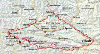 Karte einer Wanderroute in den Alpen, die von Villach in Österreich über verschiedene Orte bis nach Italien führt, mit markierten Bergen und Wegen.